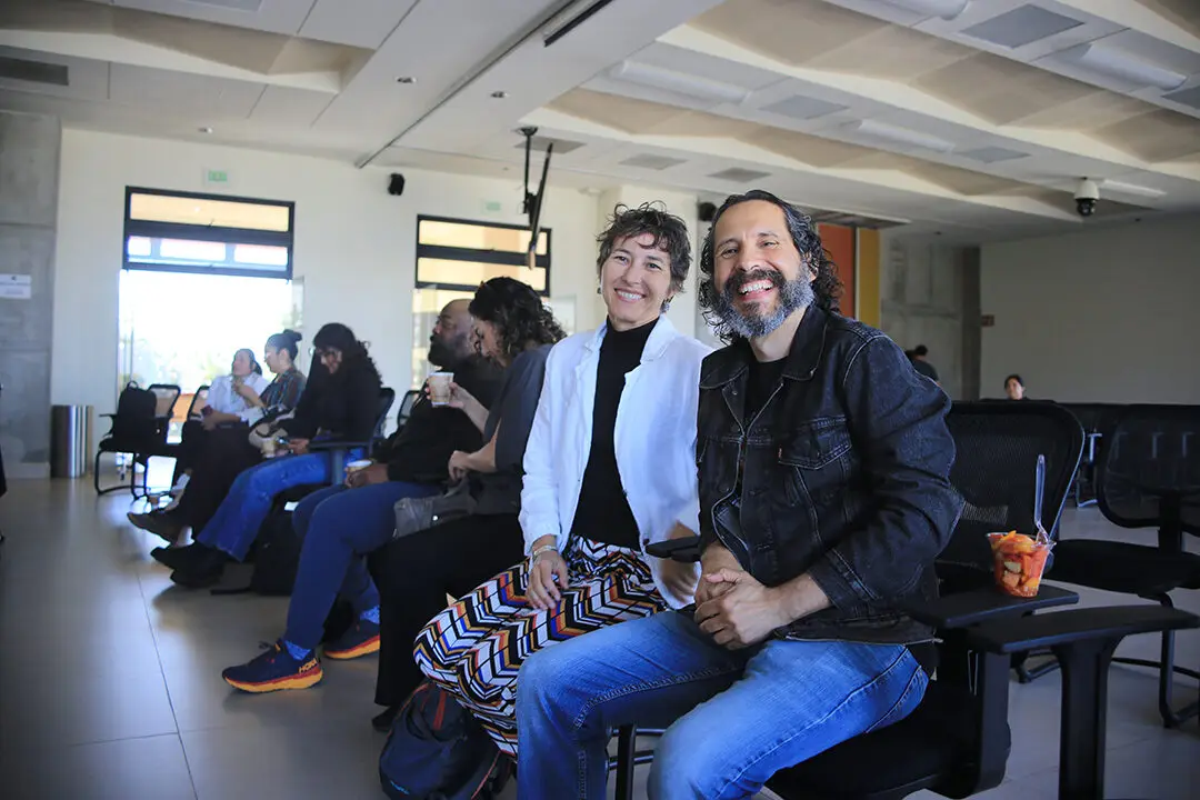 Network members seated together during a session