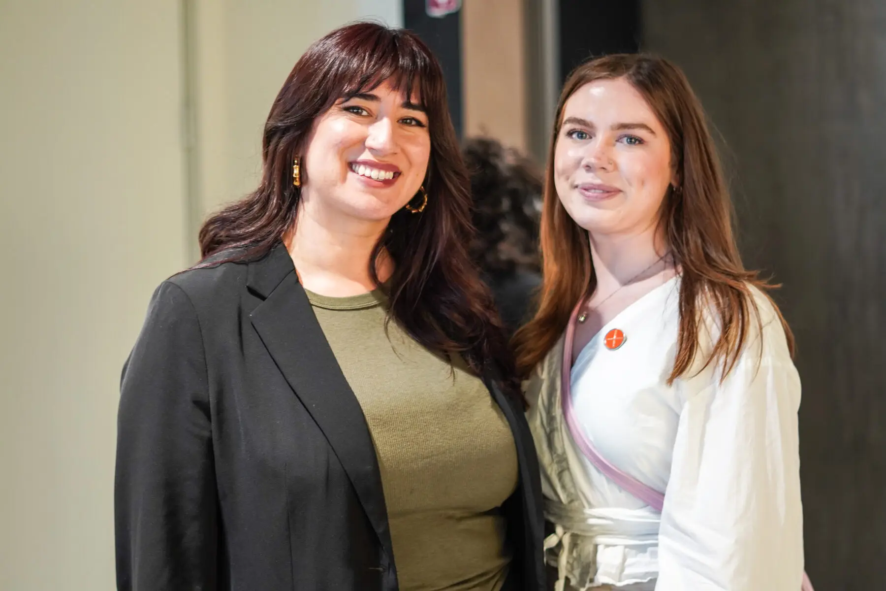 Olivia and Diana smiling together at an event