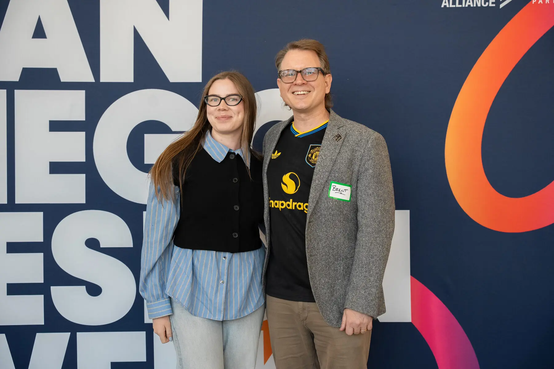 Attendees pose at the San Diego Design Week backdrop