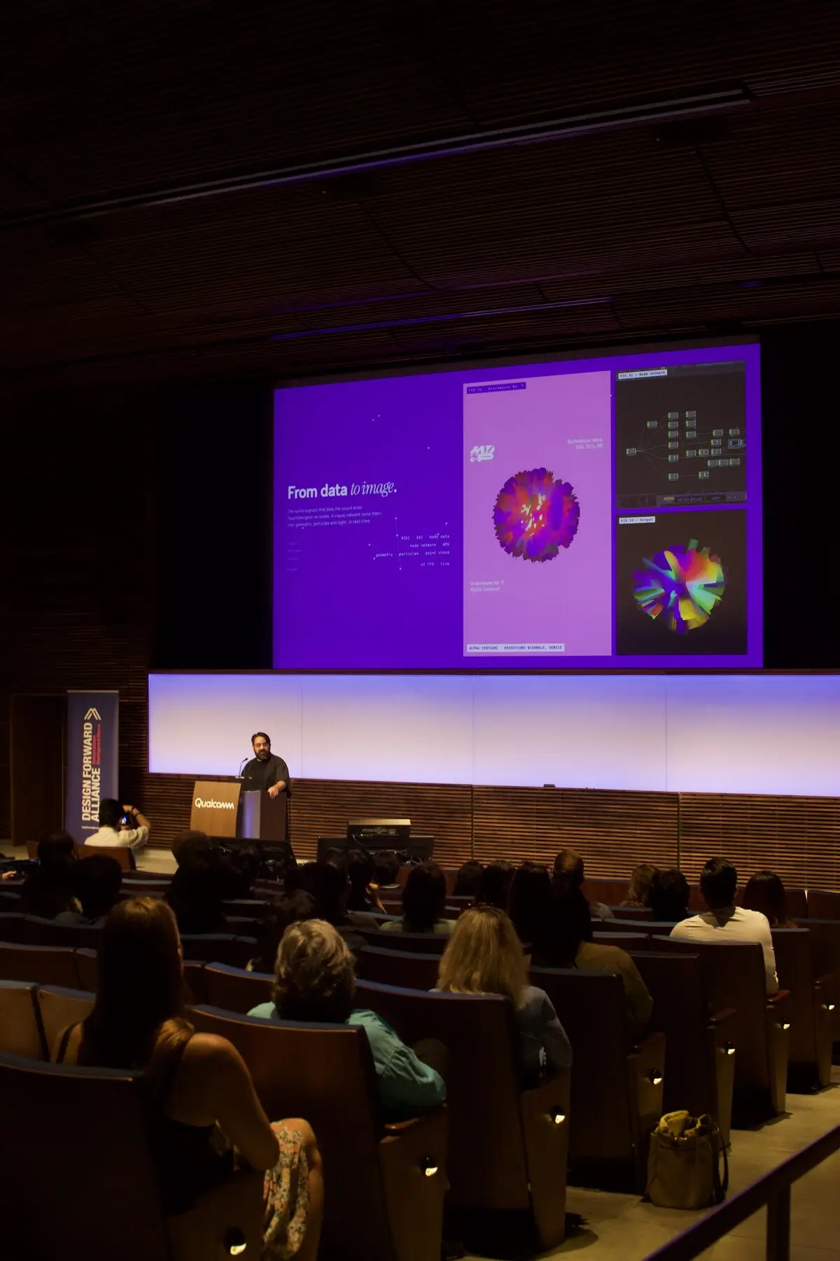 Mario D. Alvarado presents to the Qualcomm auditorium beneath a slide titled From data to image